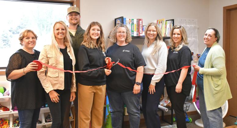 Ribbon is cut for the grand opening of Rising Hope Counseling location in Webster. From left is Rising Hope director of operations Twyla Eggers, founder Jill Janecke, counselor Amanda Kirkeby and Webster Area Chamber of Commerce members Amy Fischer, Lindsey Olson, Bailey Meyer and Alisha LaCourse. In back is Kirkeby’s husband Brody. Reporter &amp;amp; Farmer | Leyton Beardslee