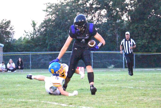 Waubay-Summit tight end Hogan Hlavacek narrowly escapes a Redfield defender Sept. 4. Mustangs defeated the pheasants by a comfortable 50-0 margin, securing its third win of the season and first place in the Eastern Coteau 9-man division. Reporter &amp; Farmer | Timothy Gibson