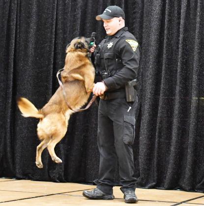 2025 Webster Area Farm and Home Show was at the Webster Armory Jan. 24-25. A dog demonstration by South Dakota Highway Patrol Jan. 24 displayed some skills the dogs use to locate the scents of narcotics. Here, Trooper Nathan Monger braces as his dog Dax jumps up on him after he found the narcotic scented prop for the demonstration. Reporter &amp;amp; Farmer | Brenner Cariveau