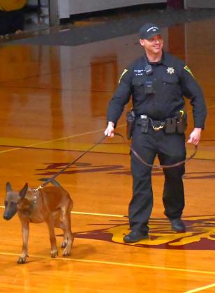 Brandon Miller a United States Marine Corps veteran gave a speech at Webster Area’s Veterans Day assembly at Webster Armory Nov. 11 joined by his South Dakota Highway Patrol K-9 dog named Lucky. Miller addressed students and community members about the importance of honoring veterans. Reporter &amp;amp; Farmer | Connor Handrahan