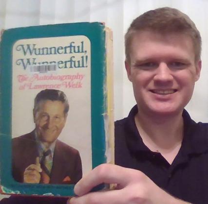 Scott Wheeler of Tallahassee, FL holds up a copy of Lawrence Welk’s autobiography Wunnerful, Wunnerful! Since January, Wheeler has been gaining letters of support for his mission to receive a symbolic resolution from congress to honor Welk and the cast of the show which featured accordionist Myron Floren from Roslyn. Reporter &amp;amp; Farmer | subscriber snapshot