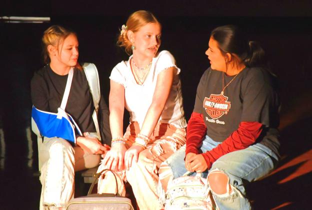 Taylee Cyrus, left, and Kloey Garrett, middle, play the parts of characters welcoming welcoming the new girl,played by Ava Huggett, right, in Webster Area School’s one act play Bus Stop Jan. 25. In the show, Huggett’s character just started at this school due to issues at home and is fighting mental battles. Cyrus’ and Garrett’s characters have to decide if their duo of fun can include another. Reporter &amp;amp; Farmer | Connor Handrahan