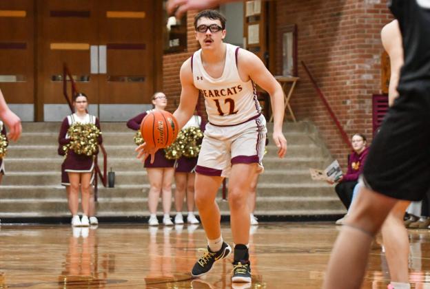Jeron McCreary (12) of Webster Area looks for an opening during the Bearcats 73-53 win over Waverly-South Shore Coyotes Jan. 27 in Webster. McCreary aided in the victory with a nine point performance. Reporter &amp;amp; Farmer | Leyton Beardslee