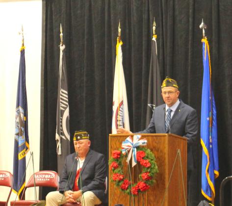 Retired Master Sergeant Dan Kroll, right, who served 26 years in the U.S. Air Force, delivers the keynote address at the Memorial Day service at Webster Armory. Local VFW Commander Kevin Bohn, left, delivered the welcome and closing notes. Reporter &amp;amp; Farmer | Timothy Gibson
