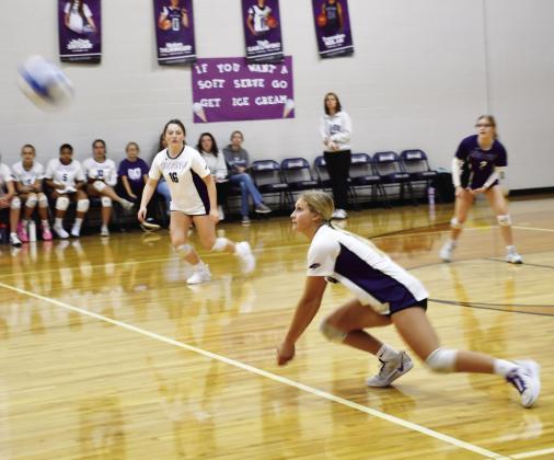 Waubay-Summit Mustangs closed out their regular season as they hosted Webster Area Bearcats Oct. 29. The Mustangs fell in three sets to the Bearcats. Here, Kayce Berger (14) dives for the ball while her teammates JoZee Snyder (16) and Brianna Lindholm (2) watch closely preparing to make a play on the ball. Reporter &amp;amp; Farmer | Brenner Cariveau