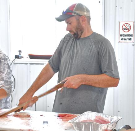 The Master Walleye Circuit was held in Webster at Bitter Lake Aug. 21-22. According to Webster Area Chamber of Commerce president Kelsey Kading, “It took a lot of work and a lot of people, but it was a great turnout and a good weekend for everyone.” Here, Greg McMartin is helping other community members clean fish for the fish fry that was held after the tournament. Reporter &amp; Farmer | Connor Handrahan