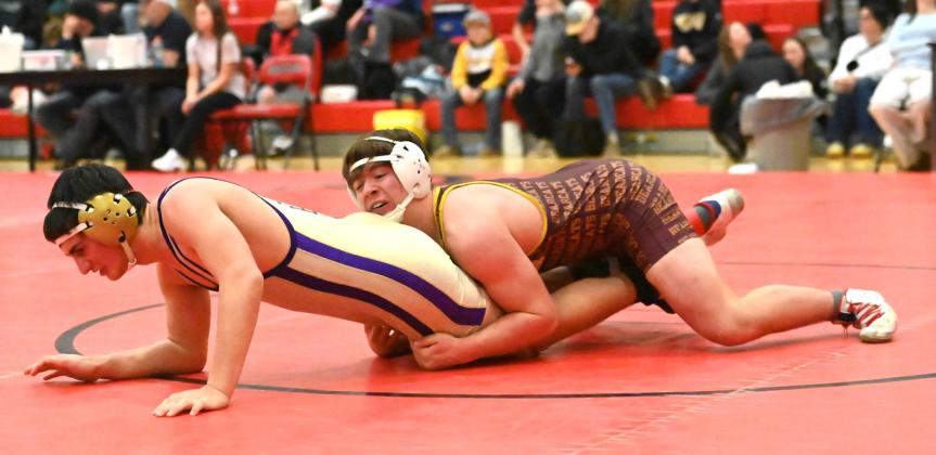 Nathan Hubsch of Webster Area Bearcats attempts to pin his opponent during their match in the Battler Wrestling Invitational Jan. 17 in Gettysburg. Hubsch placed fifth with a record of 4-2 and scored 17 team points. Reporter &amp;amp; Farmer | Brianna Jorgenson, Captured Creations Photography