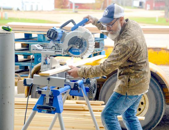 Shawn Andres is a newcomer the Sleep in Heavenly Peace Sisseton chapter who was on scene at Waubay last weekend for a bed build event. Here, he helps measure and cut 2x4s for the other volunteers to use to start building beds. Reporter &amp;amp; Farmer | Connor Handrahan