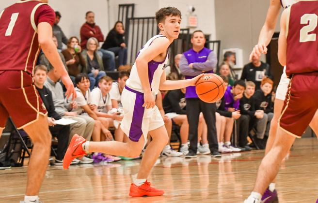 Zayne Strang of Waubay/Summit Mustangs evades defenders during the Mustangs 40-38 victory over Milbank Bulldogs Jan. 20 in Summit. The win ended a four game losing streak for Waubay/Summit who now hold a record of 4-5. Reporter &amp;amp; Farmer | Leyton Beardslee