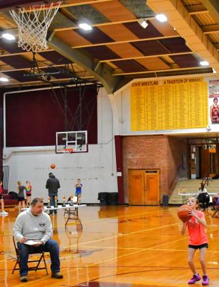Reporter &amp;amp; Farmer | Connor Handrahan Knights of Columbus held the annual free throw contest for ages 9-14 Jan. 25. To the right Lindsey Butler is shooting her free throws being judged by Tim Gaikowski.