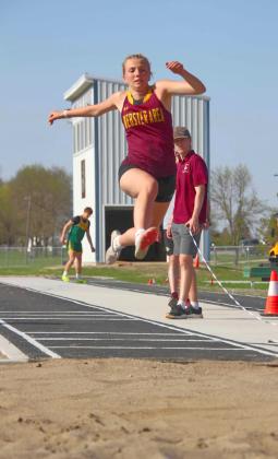 Webster Area 11th grader Sarah Zubke goes airborne during the Valley Queen Cheese Invite at Milbank May 6. Reporter &amp;amp; Farmer | Subscriber Snapshot