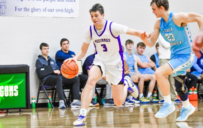Hogan Hlavacek (3) of Waubay/Summit drives up court during the Mustangs narrow 48-49 loss to Leola/Frederick Titans Jan. 3 in Waubay. Hlavacek ended the game with a team-high 22 points. Reporter &amp;amp; Farmer | Leyton Beardslee