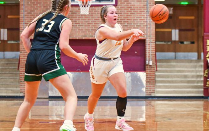 Bailee Ninke (22) of Webster Area dishes out a pass during the Bearcats 34-58 loss to Clark/Willow Lake Jan. 10 in Webster. Ninke finished with a team high 16 points and nine rebounds. Reporter &amp;amp; Farmer | Leyton Beardslee