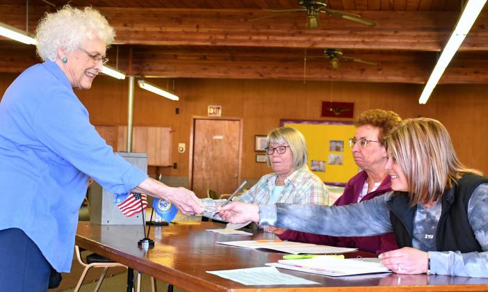 Linda Witt was the final person to cast a ballot at the Bristol Community Center April 9 before the polls closed during the special Groton Area School District election. Here poll workers, Kathryn Bury, Kris Hubsch and Sara Johnson check Witt in and hand her a ballot to cast a vote for or against the opt-out. At the end of the day, the opt-out passed 567 to 275. There was a 33 percent district voter turnout with 842 of 2,572 voters turning out. Reporter &amp;amp; Farmer | Amanda Dulitz