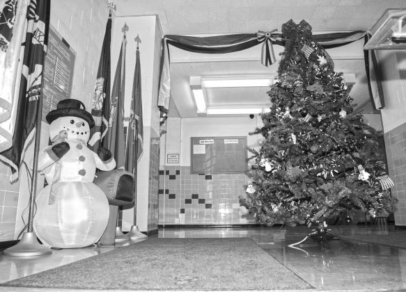 At the Day County Courthouse main entrance guests are greeted by Frosty and an American themed Christmas tree. The courthouse is filled with more themed trees decorated by organizations and businesses and on display until Jan. 5. Reporter &amp;amp; Farmer | Connor Handrahan