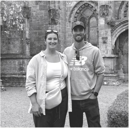 Reporter &amp;amp; Farmer \\ subscriber snapshot Roslyn, SD residents from left Lindsey (Schoenbeck) Koenig and John Koenig stand outside the Rosslyn Chapel in Roslin, Scotland. The Scottish village has had different spellings over the years but was the namesake for Roslyn, SD which was named by Lindsey (Schoenbeck) Koenig’s great great great great grandfather Henry Horace Russell who was the first Postmaster for Roslyn, SD in 1882 and immigrated from Scotland to the U.S. in 1849.