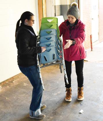 Furniture was being moved from the Knapp &amp;amp; Play Learning Center to the Lake Region Business Center Feb. 21 to make room for renovations. Here from left, Rainy Hanson grabs chairs from Nancy Block as part of the moving process. Reporter &amp;amp; Farmer | Brenner Cariveau