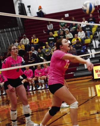 Webster Area Bearcats volleyball faced off against Northwestern Wildcats Oct. 14. Here, Karli Sannes (12) attempts to hit the ball to set up a play for her teammates as Northwestern player Ashley Haven (4) watches in anticipation. Ultimately, the Bearcats lost in three sets. Reporter &amp;amp; Farmer | Brenner Cariveau