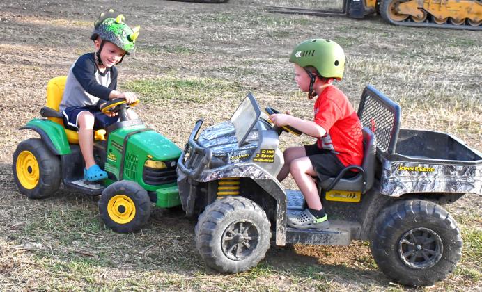 Before the demolition derby at the Day County Fair Aug. 8. the power wheels class battled against each other. From left, Braven Johnson gets his tractor stuck and Grayson Bierschbach takes advantage and rams his truck as hard as he can into the tractor. Reporter &amp;amp; Farmer | Connor Handrahan