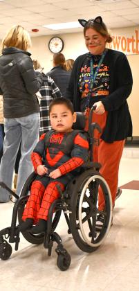 Webster Area first grade student Greyson Brave Bull and paraprofessional Kristen Marko take part in a Halloween costume parade Oct. 31 at Webster Area Elementary. Brave Bull is the son of Chris and Leta Brave Bull. Reporter &amp;amp; Farmer | Leyton Beardslee