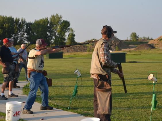 Rick Hanson takes aim at a target Aug. 25 at Webster Claybird Club. Trap shooters line up in groups of five, taking five shots from each position – 25 shots in total. From left to right: Doug Herold, Rich Proctor, Donnie Bloom, Roland Hanson and Paul Dulitz. Reporter &amp; Farmer | Timothy Gibson