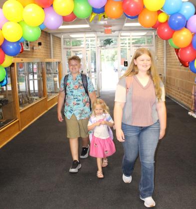 Students walk through the entrance hall of Waubay School, returning from summer break for the first day of class Aug. 19. From left are Jayce Johnson, Hope Johnson and Faith Gaikowski. Reporter &amp; Farmer | Timothy Gibson