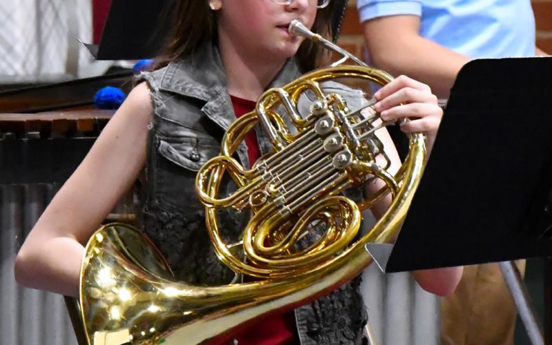 Sixth grader Cheyenne Powell plays the French horn during Webster Area School’s elementary spring concert April 24.