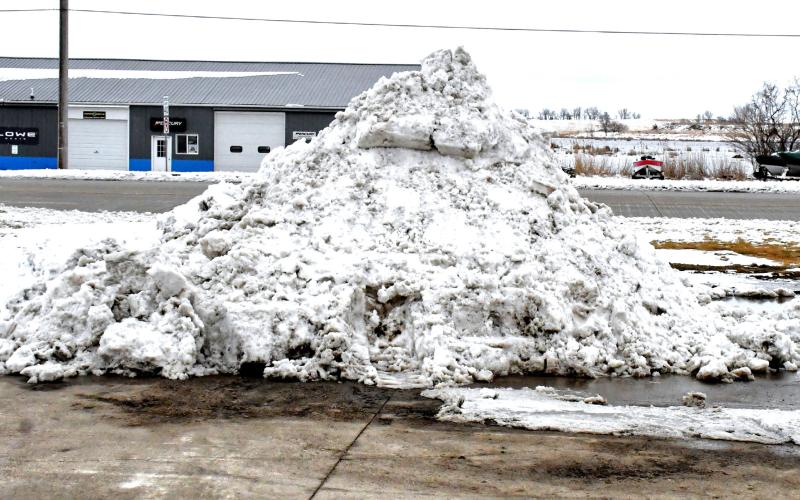 Along U.S. Hwy. 12 on the north side of Webster the snow starts to pile up as another snowfall hits Day County. Parking lots and roads were filled with slushy snow April 2 and luckily the snow stopped for a while and people were able to start cleaning up the mess the weather left behind. Reporter &amp;amp; Farmer | Connor Handrahan