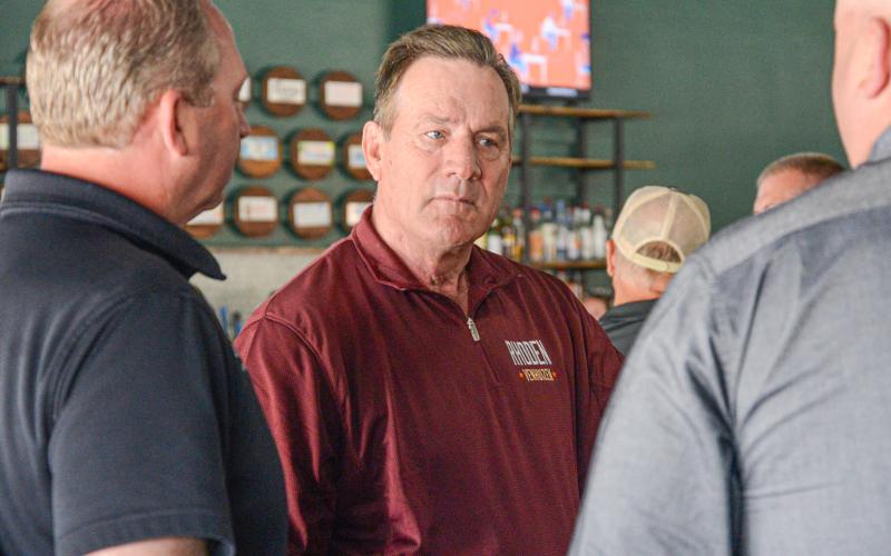 South Dakota sitting governor Larry Rhoden was at a meet and greet event in Webster May 28 ahead of the June 2 primary election. Shown here, he visits with Brett Kwasniewski and Jeremy Lindemann of Lake Region Electric. Reporter &amp;amp; Farmer | Amanda Dulitz