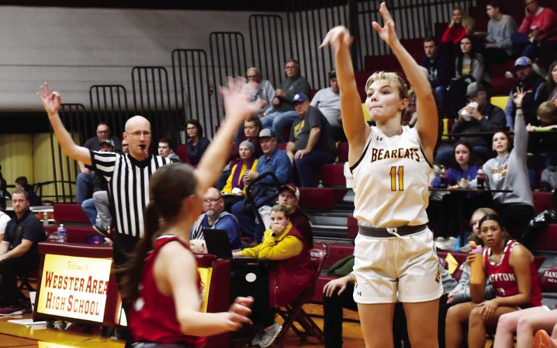 Webster Area girls basketball hosted Britton-Hecla Dec. 20 at the Webster Armory. Bearcats won the contest 50-29. Here, Webster Area guard Lydia Vogl (11) shoots a three pointer while Britton-Hecla defender Heather Storbakken (3) closes out to the three point line. Reporter &amp;amp; Farmer | Brenner Cariveau