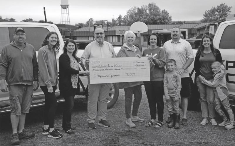 Day County Community Foundation donated $100,000 to Webster Area School's playground equipment project. Pictured from left are Mike Ninke, Emily Wagner, Allegra Duerre, Todd Garry, Rita Johnson. Alyssa and Huck Shoemaker, Craig Case and Natalie and Lucy Kuecker. Reporter &amp;amp; Farmer | Annie Witt
