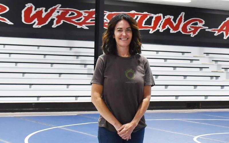 Part owner and founder of Sniper Wrestling Academy Kara Pharis stands in the newly renovated wrestling room which was once the Bristol school gym. Reporter &amp;amp; Farmer | Annie Witt