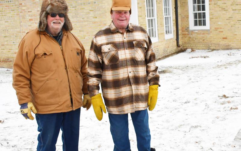 Chestnuts were being roasted for all attendees to try Dec. 14 at the Fort Sisseton Historical State Park’s Frontier Christmas. Here from left, Ernie Richards from Beaver and Kenny Anderson from Webster stand next to the fire pit as they wait for the chestnuts to roast. Reporter &amp;amp; Farmer | Brenner Cariveau