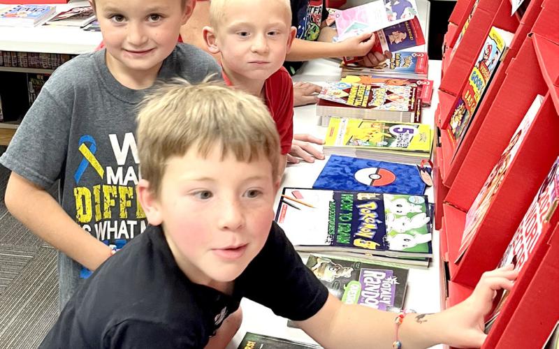 Front to back, Rogan Rithmiller, Brody Shafer, Landon Kvernevig, Cruz Shafer and Eli Ploof enjoyed looking through the selections at Webster Area School’s bookfair Oct. 7-10. Reporter &amp;amp; Farmer | Subscriber snapshot