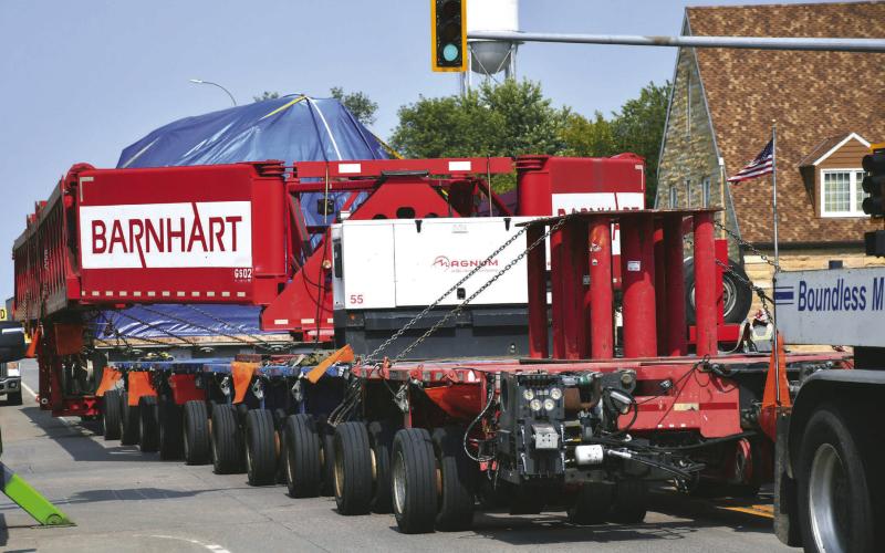 A steam turbine hauled on a trailer by three semi-trucks is pulled down Main St. in Webster Sept. 8. South Dakota Department of Public Safety was unable to release details about the turbine’s exact destination or owner but a pilot vehicle driver confirmed it was going to be heading north to Canada. The rig had an excess of 200 tires. Reporter &amp;amp; Farmer | Leyton Beardslee