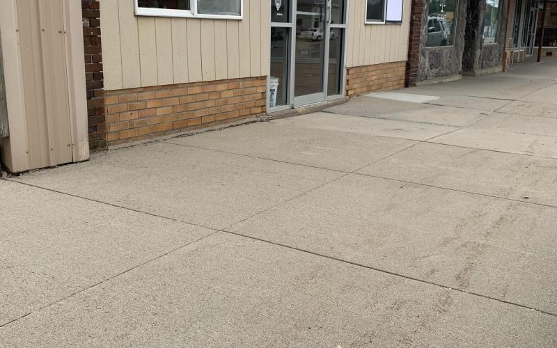 Rocks pictured Sept. 15 on Main St. in Webster were thrown from atop businesses towards adjacent businesses by two juveniles who were apprehended the night of Sept. 14. Two of the windows pictured at 508 Main St. were broken and patched. Reporter &amp;amp; Farmer | Amanda Dulitz