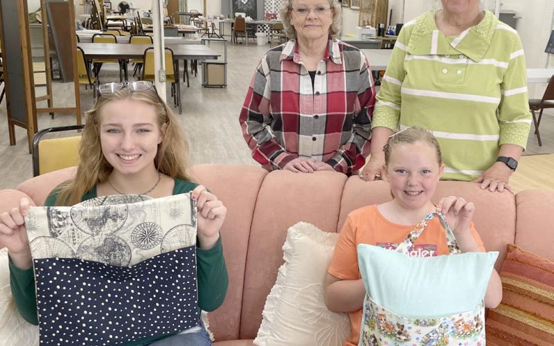 Day County Arts Council, wGlacial Lakes Piece Makers and Day County 4-H sewing workshop was June 22 at Day County Arts Center, Webster. An on-the-go travel pillow was constructed with guidance from instructors, standing, Sandy McCarlson, left and Denece Draper; seated, participants Delilah Buxton, left and Christine Hughes. Reporter &amp;amp; Farmer | Subscriber snapshot