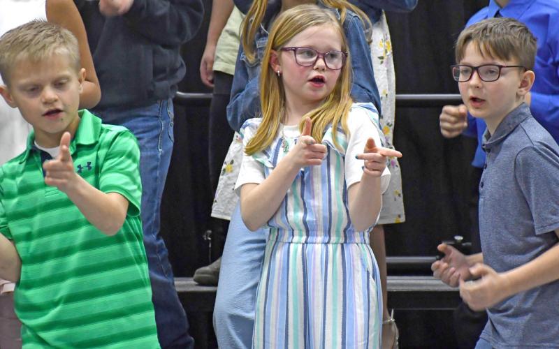 Waubay Elementary students hosted their spring concert April 10 and were moving and grooving throughout the show. With the theme, “How Does Your Garden Groove” and “I Love Rock ‘N Roll” students performed such numbers as “Lettuce Entertain You,” “Please Don’t Put Us in a Can Can” and “Vegematic, Automatic.” Shown here are Blair Berger, Larissa Butler and Maxxim Niles. Reporter &amp;amp; Farmer | Amanda Dulitz