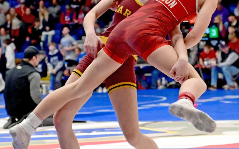 Macee McGregor picks up Sisseton Redmen wrestler Clara Iverson during the Lee Wolf tournament Feb. 1, winning via decision for a fifth place finish in the 120 pound girls division. Reporter &amp;amp; Farmer | Subscriber snapshot