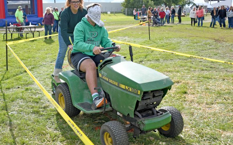 Participating in the lawn mower races at the first annual Harvest Bash Sept. 6 were April Hodges and her son Seth Hodges, 14. The duo, along with April Hodges’ other son Zach, traveled to Webster from Pierre to take in the festivities at the Day County Fairgrounds. See more from the day on 15. Reporter &amp;amp; Farmer | Amanda Dulitz