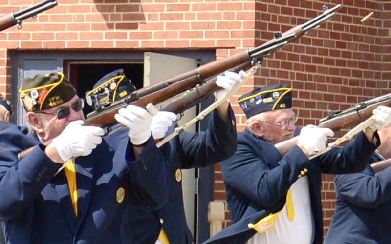 Shots were fired in a 21-gun salute to fallen veterans during the Webster Memorial Day program at the Webster Armory May 27. Members of the VFW and American Legion Honor Guard shown here are Tom Lewno, Doug Lynch and Ed Damrau. Reporter &amp;amp; Farmer | Amanda Dulitz