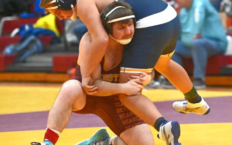 Matthew Angiolelli of Webster Area Bearcats lifts his opponent during the Webster Holiday Tournament Jan. 3 at Webster Armory. Angiolelli placed third in the 215 weight class with a record of 3-1. Reporter &amp;amp; Farmer | Brianna Jorgenson, Captured Creations Photography