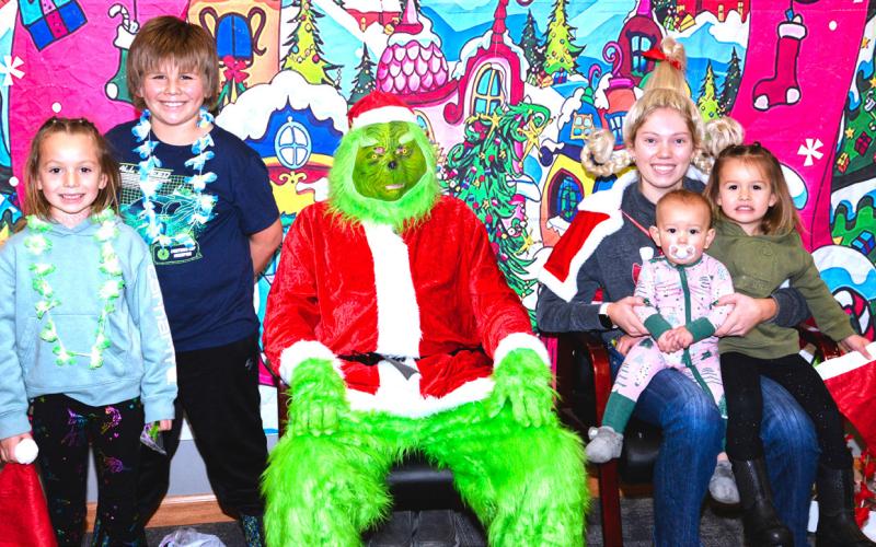 The Grinch and Cindy Lou Who met with families at Waubay Senior Center’s Christmas celebration Dec. 6. Violet, Braxton, Brynleigh and Lesedi Renville talked and joked with The Grinch and Cindy Lou Who. Jokingly, everyone kept their distance from The Grinch, just in case he tried something. Reporter &amp;amp; Farmer | Connor Handrahan