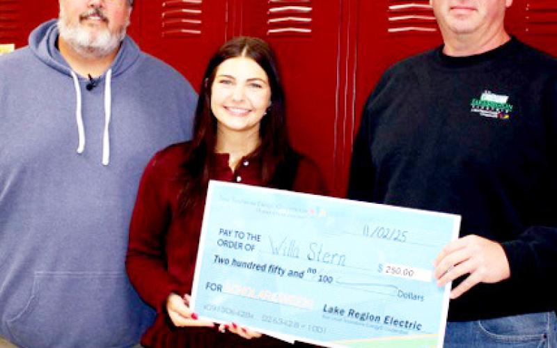 Webster Area High School student Willa Stern was chosen Touchstone Energy Scholar of the Week and will be featured on Dakota News Now. Pictured from left Adam Mines of Webster Area School, Stern and Brett Kwasniewski of Lake Region Electric. Reporter &amp;amp; Farmer | Subscriber snapshot