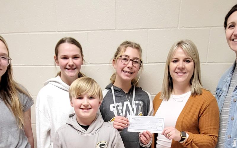 Webster Area Student Council members, front Barrett Bloom, fourth grade; back, from left, eighth graders Claire Halvorson, Sophia Wilson and Remi Hubsch presented a $1,000 check to playground committee members Vanessa Bloom, fifth grade teacher and Emily Wagner, second grade teacher. Funds were raised through last fall’s Driven Coffee fundraiser and will support the new playground and gym floor project. Reporter &amp;amp; Farmer | Subscriber snapshot