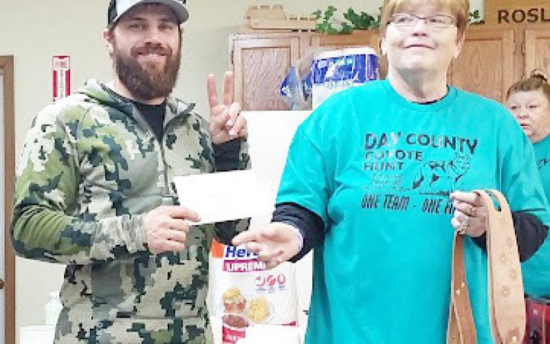 The 18th annual coyote hunt took place Dec. 13-15 in Roslyn. As the event unfolded 74 total coyotes were harvested with 24 teams participating. Here, second place winner Cody Scarrott, left, receieves his $500 check from event organizer Patti Mitchell. In addition to his monetary winnings, Scarrott was also awarded two leather gun slings. Reporter &amp;amp; Farmer | Subscriber Snapshot