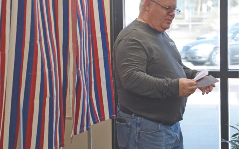 Mike Wiley of Webster exits the voter booths at Webster Area High School office April 8 after casting his ballot in the Webster Area School District board member race. Seven candidates were vying for two open seats on the board. Wiley was among a reported 19 percent voter turnout of 518 individuals. There are 2,676 registered voters in the school’s district. Reporter &amp;amp; Farmer \\ Amanda Dulitz