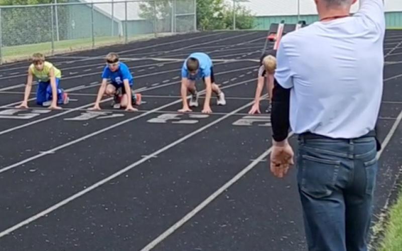 Webster Area Youth Track and Field Meet took place June 29. Robert Kwasniewski raises the starting gun for the boys ages 11-12 100 meter race. Kwasniewski volunteered his time as the official starter of the meet. Runners pictured from left are Colton Hanson, Cooper Gangle, Tak Lesnar and Hunter Sinner. According to event organizer Brandy Gangle, almost 40 kids participated and she plans to continue putting on the event in future years. Reporter &amp;amp; Farmer | Subscriber snapshot