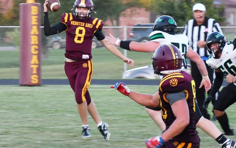 Webster Area quarterback Ian Lesnar attempts a pass on the run Aug. 30 against McCook Central/Montrose. Bearcats had little success on offense as the game finished with a score of 6-33, resulting in a Webster Area loss. Reporter &amp;amp; Farmer | Brenner Cariveau