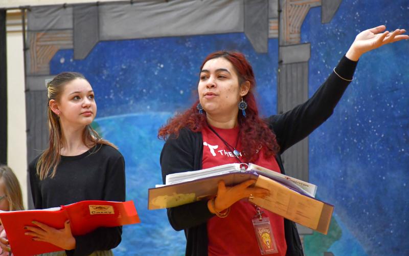 Webster Area middle schooler Taylee Cyrus, left, watches Theatre 605 director Noelle Hall during a rehearsal March 11 for their production at Webster Area School. After a week of auditions and rehearsals their musical performance of Space Pirates was held March 13 with Cyrus performing as the character Casey. Reporter &amp;amp; Farmer | Leyton Beardslee